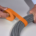 Photo of Rip-Tie 1/2 x 8 Inch Perforated RipWrap 225 Piece Roll (Orange)